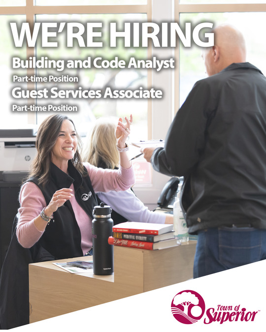 We're hiring text overlaying a photo of guest services.