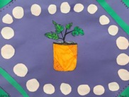 Artwork made by a Superior Elementary School student featuring a green plant in an orange pot