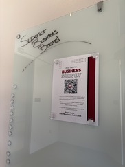 White board reading Superior Business Board with flyer promoting 2026 Business Survey
