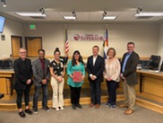 Superior Town Council members pose in council chambers with volunteer Michelle Gazarik, who was recognized for volunteerism