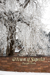 Town of Superior Purple Park sign in snow