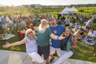Friends posing for a picture during the Summer Concert Series.
