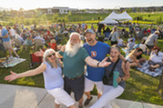 Friends posing for a picture during the Summer Concert Series.