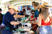 Volunteers serve pancakes at Superior's 4th of July Celebration