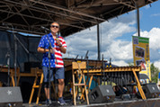 Superior Mayor Mark Lacis wears an American flag shirt and speaks a crowd on the 4th of July