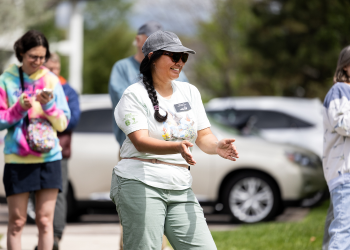Open Space Ranger Phary Om claps during a Superior World Migratory Bird Day event