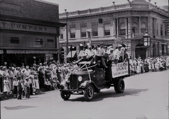 Colorado Day parade at 13th and Pearl in Boulder August 1, 1934. National State Bank on right and J.C. Penny store at left.