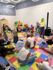 Kids play on colored mats at Jump, Shout, Get Your Wiggles Out