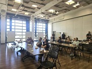 People sit at tables in the Superior Civic Space during the Ready Together post-drill meeting and lunch