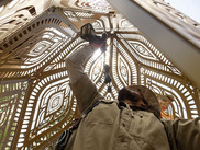 HYBYCOZO construction of metal latticed piece from interior with person using drill to connect pieces