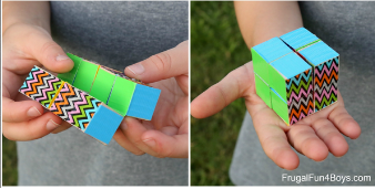 hand holding a multi-colored cube 