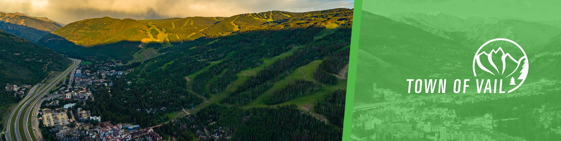 Drone view of Vail at night with Town of Vail logo