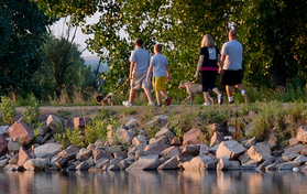 A family walks along the trail around Milavec Reservoir at the Frederick Recreation Area.