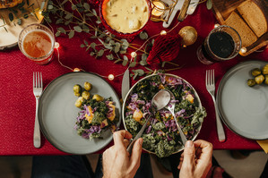 Overhead tabletop view of a bowl of kale salad