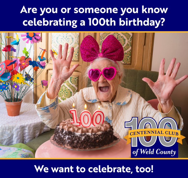 Excited lady with sunglasses and 100th birthday cake