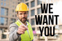 Construction worker with the words "We want you" showing