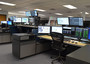A chair, a desk and computers inside the Weld County Regional Communications Center.
