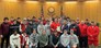 The Eaton Reds football team with the Board of Commissioners