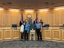 Mark Mellon with his family and the Board of Commissioners