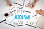 Hands writing on notepads and paper. Text in center of graphic reads, "Action Plan."