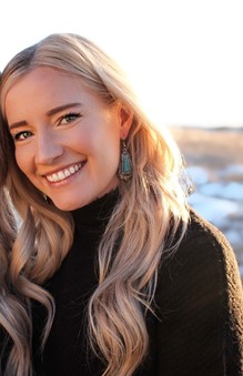 Kristen Sigg smiling.