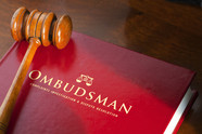 An ombudsman book with a gavel.