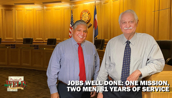 Steve Moreno and Don Warden standing in the Centennial Hearing Room. Text reads: "Jobs well done: One mission, two men 81 years of service."