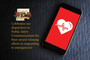 A phone with a heart on it.