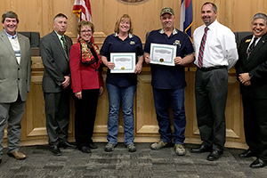 Terri Mohrlang and Butch Gillingham standing with the board of Commissioners and Facility Director, Toby Taylor, in 2017.