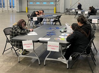 Young people at the job fair filling out applications!