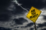 A sign reading "are you ready?" with a lightning strike in the background.