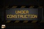 A construction sign with the words "under construction" written on it.