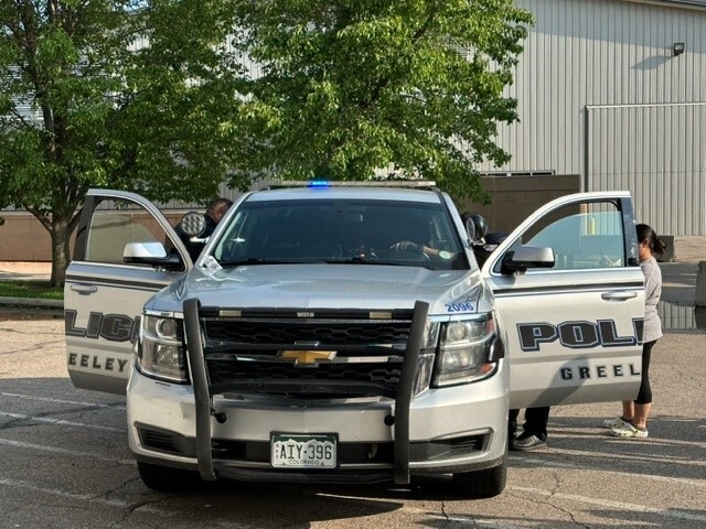 Police car with kids looking inside