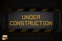A road construction sign with the words "under construction written on it."