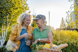Older ladies walking with healthy food in baskets