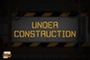 A road closed sign with the words "under construction" written on it. 