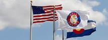 Weld County flag, United States flag and Colorado flag.