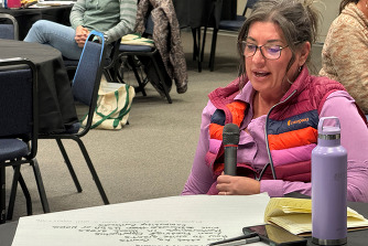 A woman speaking at the 2023 Woman in Ag Conference.