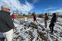 People standing near an air quality control site in Weld County.
