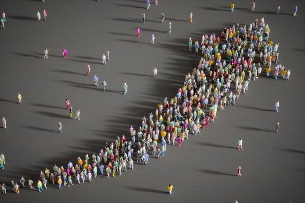 Large group of people forming an upward arrow. 