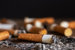 Cigarette butts on a black background. 