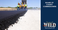 Asphalt being poured onto a roadbase.