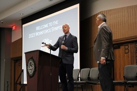 Andrew Chadwick, right, at the annual Workforce Symposium. 