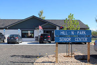The Hill N' Park senior center sign with the actual center in the background.
