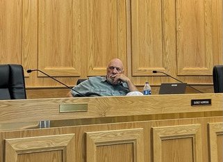 Weld County resident Barney Hammond listening during a planning commission meeting,
