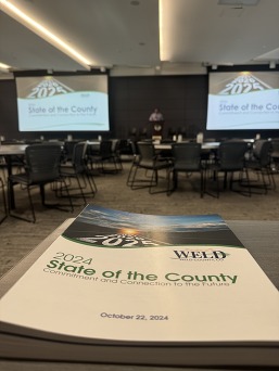 A state of the County program on a table. 