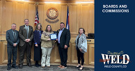 Lisa Taylor, a volunteer on a county board and commission, standing with the Weld County Board of Commissioners.