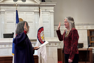 Commissioner Lynette Peppler being sworn in as a new commissioner.