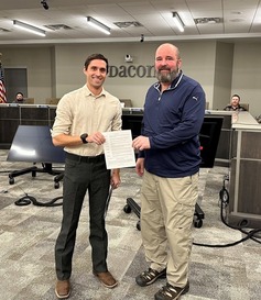 Two people shake hands