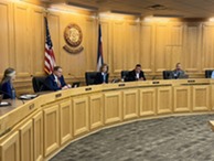 Commissioners sitting on the dias